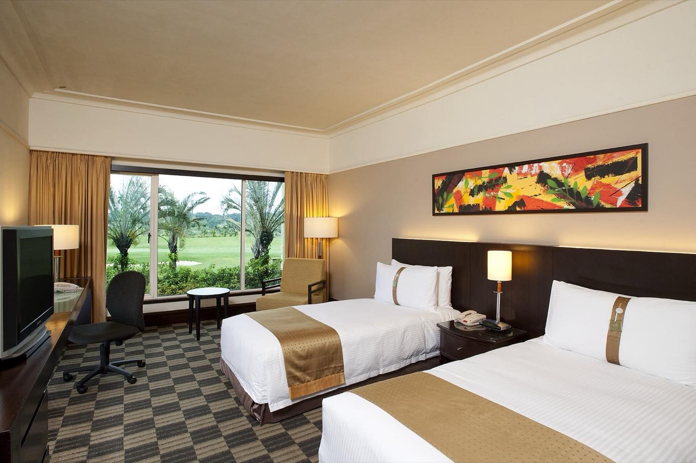 Standard air-conditioned room with two single beds and a wall-mounted air conditioning unit